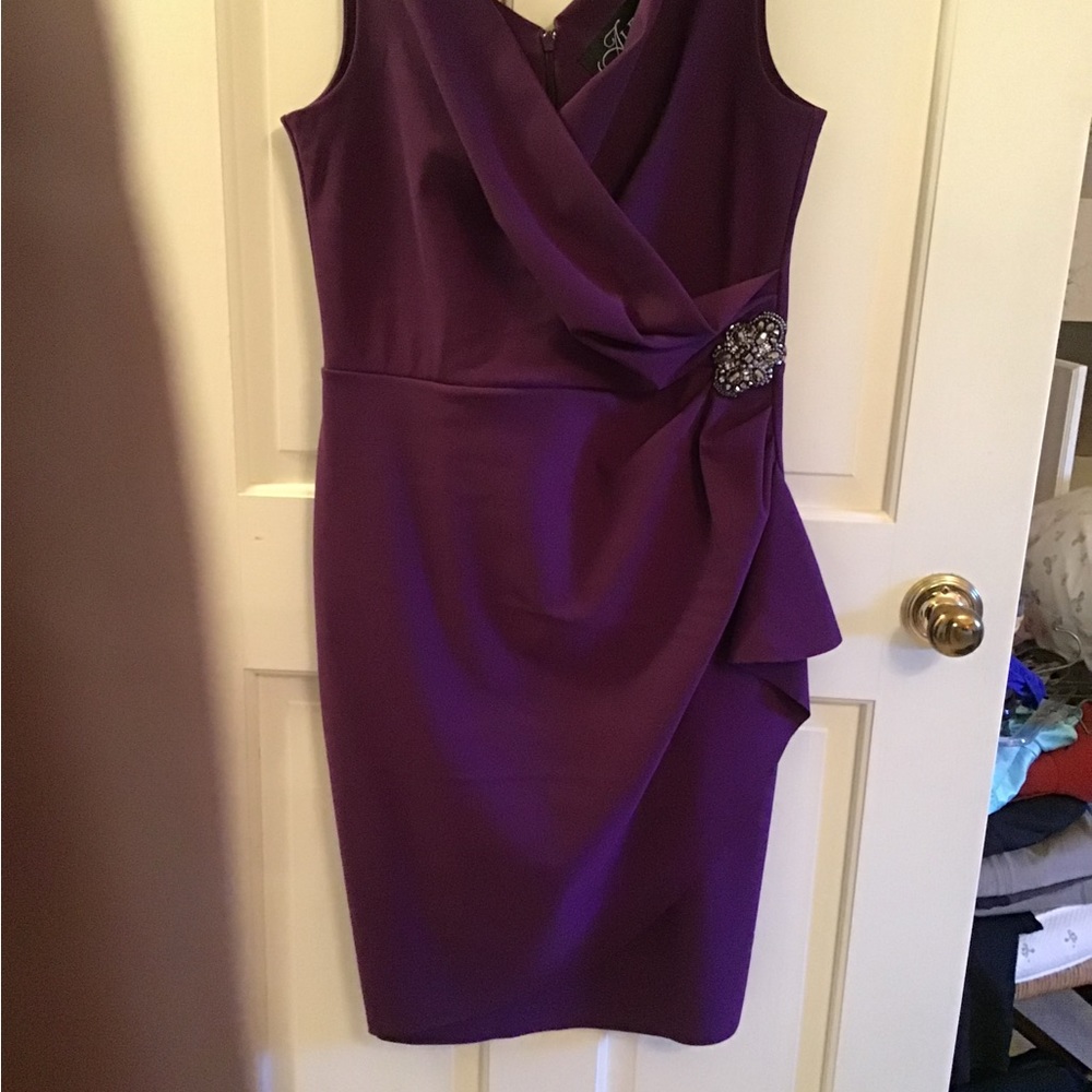 DressBeautiful purple cocktail dress with a jeweled side clasp.  Never worn